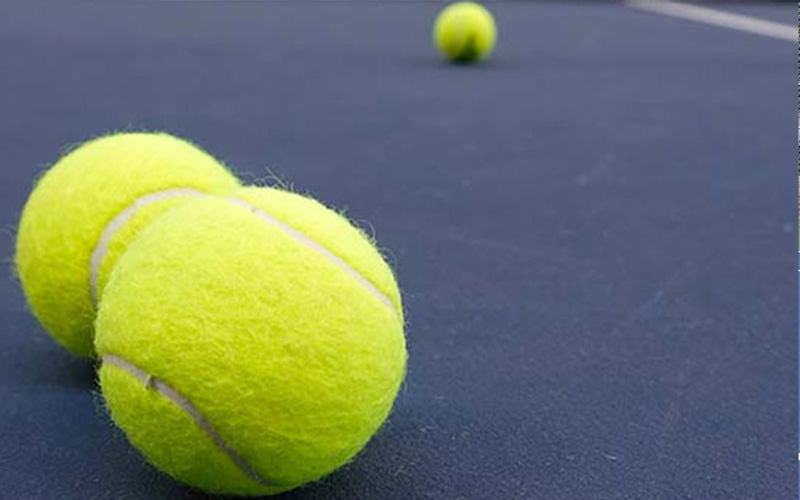Why are tennis balls yellow?